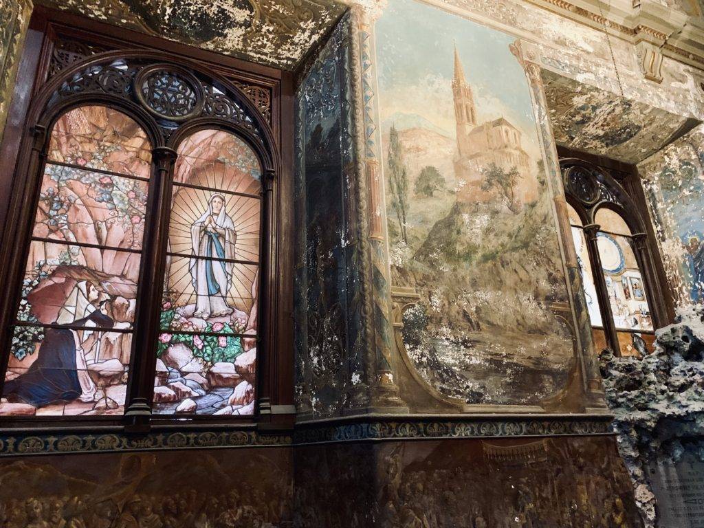 Painted windows and murals inside Iglesia la Merced church in Havana Cuba